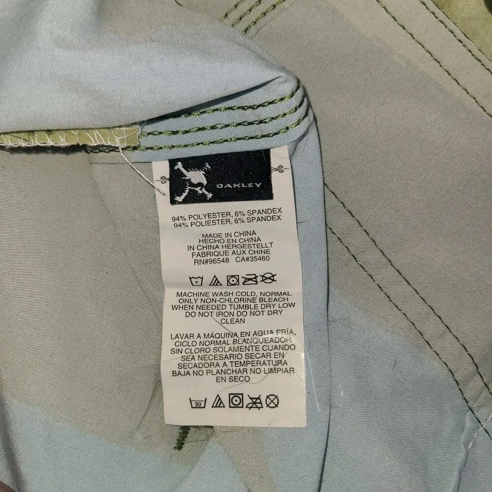Oakley Crashing Wave board shorts with a multi-color stripe pattern. Men's 34